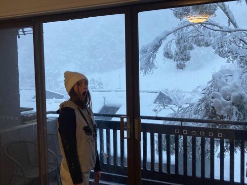 a person is standing in front of a window at Ski, Mtn Bike or Hike from the heart of Thredbo in Thredbo