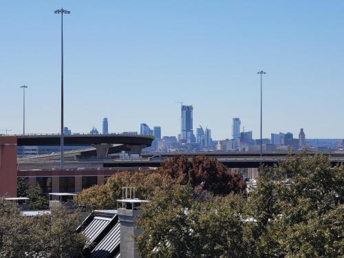 a view of a city skyline with a bridge at Hethos in Austin