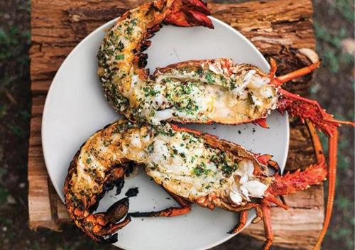 a plate of food with lobsters on a table at The Blue Lagoon Resort Kalpitiya in Kalpitiya