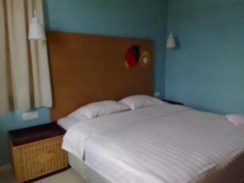 Ein Bett oder Betten in einem Zimmer der Unterkunft OYO 90709 Northern Inn