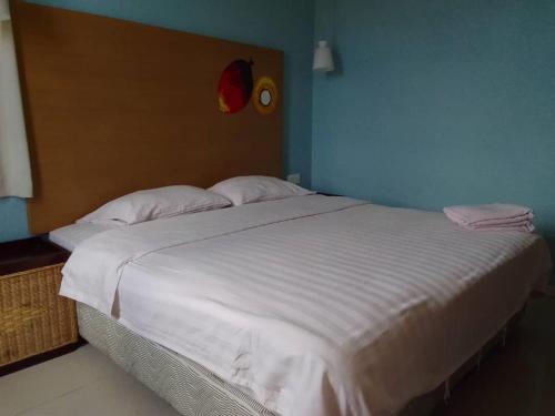 Ein Bett oder Betten in einem Zimmer der Unterkunft OYO 90709 Northern Inn