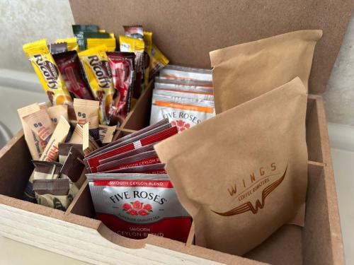 a box filled with different types of snacks at Cozy Corner Cottage in Langebaan