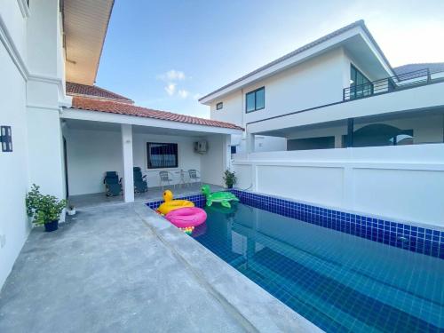 a swimming pool in a house with a pool toy at wonderland2 village KTV pool villa in Pattaya North