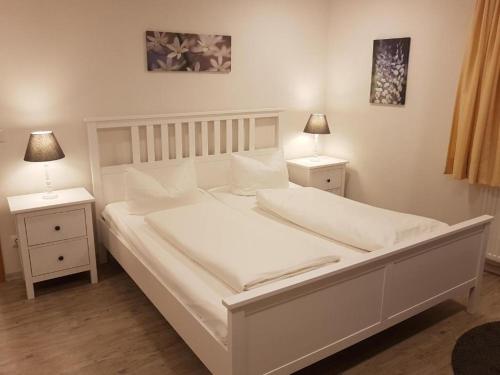 Postel nebo postele na pokoji v ubytování Hocher Hotel