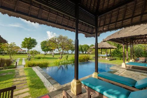 a view of the pool at a resort at Amertha Bali Villas in Pemuteran
