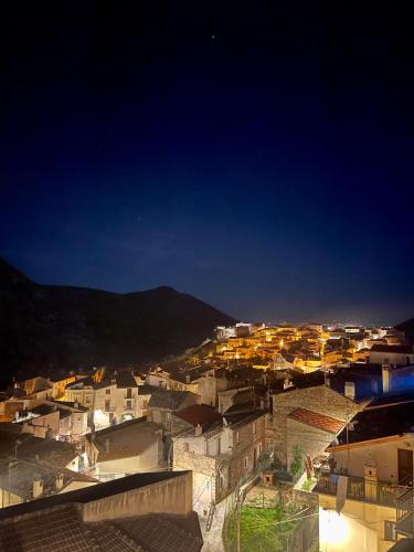 a view of a city at night at La Magara in Civita