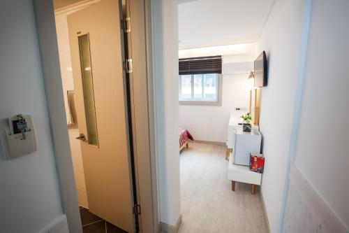 Postel nebo postele na pokoji v ubytování Petercat Hotel Shinchon