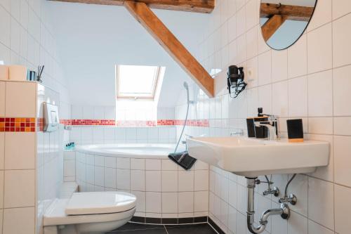 a bathroom with a sink and a toilet at Buer Appartment in Gelsenkirchen