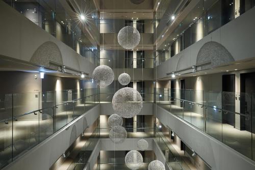 a view of a building with balls hanging from the ceiling at Shilla Stay Jeju in Jeju