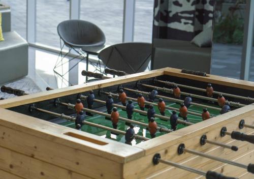 a large wooden chess board with birds on it at Modena by Fraser Bangkok in Bangkok