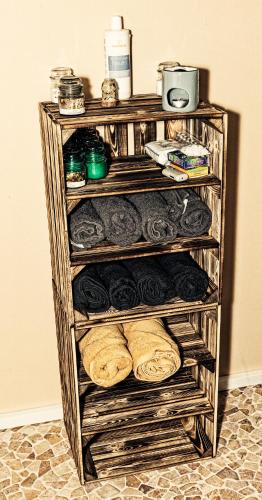 a rack with breads and other items on it at B&B AntiQua & Qook in Tongeren