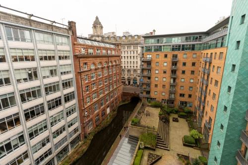 an aerial view of a city with buildings at JPG Theatre Suite - High Floor MCR Luxe Apartment w Balcony Canal Views in Manchester