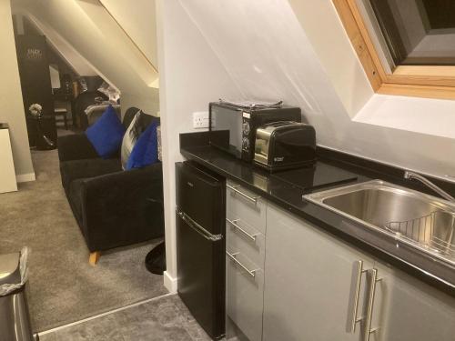 Η κουζίνα ή μικρή κουζίνα στο The spinney home stay