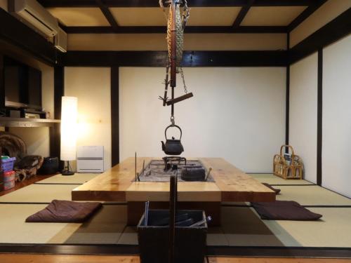 a room with a table with a camera on it at Oyado Sumire-so in Takayama