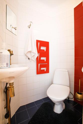 a bathroom with a toilet and a sink at Apartment Peegel in city center free parking in Tallinn