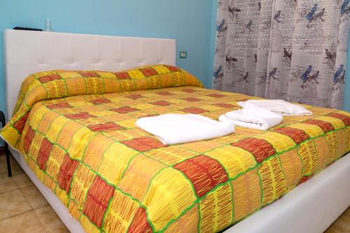 Postel nebo postele na pokoji v ubytování B&B Porta Roma