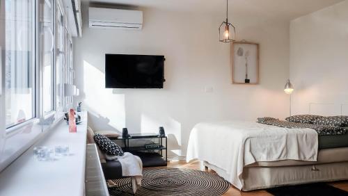 Postel nebo postele na pokoji v ubytování Cosy apartment