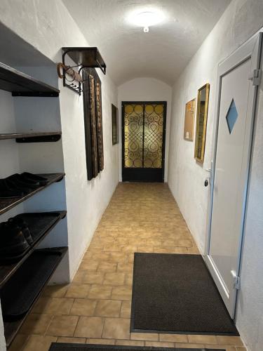a hallway with a door with a rug in front of it at Wood Apartment in Lambichl