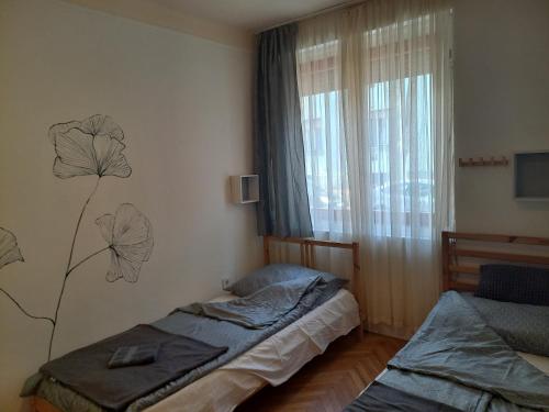 Posteľ alebo postele v izbe v ubytovaní Elefántos Apartman