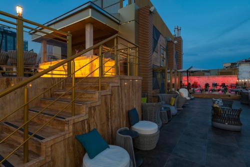 a building with stairs and stools on a patio at Ramada By Wyndham Istanbul Pera Taksim in Istanbul