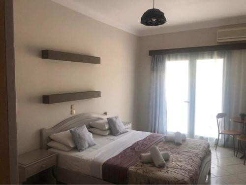 Кровать или кровати в номере Poseidon Apartments