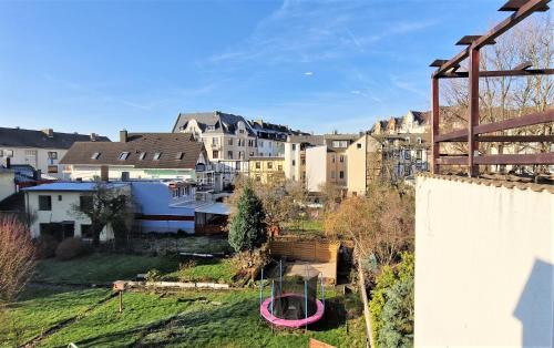 a view of a city with houses and a playground at liebenswertes Apartment 10 Minuten zur Altstadt in Koblenz
