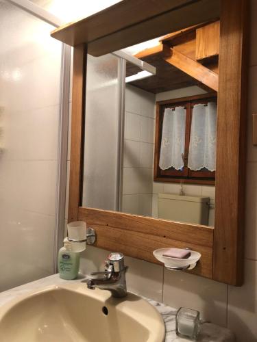 a bathroom with a sink and a mirror at Casa Stayerat-holiday home Segusino-Valdobbiadene in Sequsino