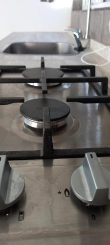 a group of pans sitting on top of a stove at Cabañas cristal y pascal in Punta Arenas