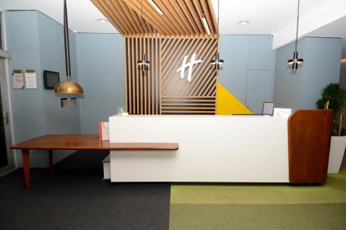 an office with a desk and a table at Holiday Inn Istanbul City, an IHG Hotel in Istanbul