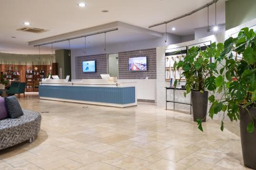 a lobby with a waiting area in a library at Barut B Suites in Side