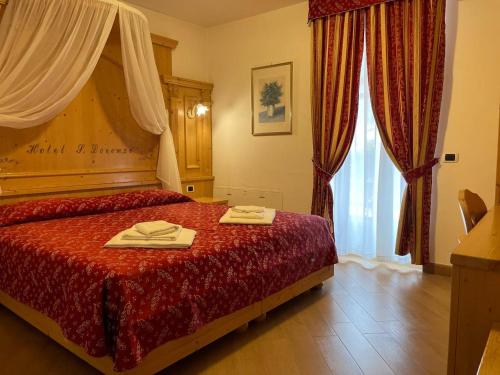 Letto o letti in una camera di Hotel San Lorenzo