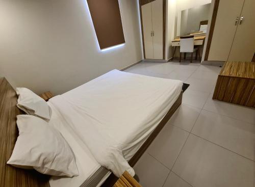 Postel nebo postele na pokoji v ubytování SPAR Serviced Apartments