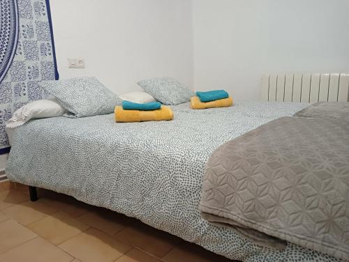 two pillows on a bed in a bedroom at Casa rural Entre Dos Rios in Murillo de Río Leza