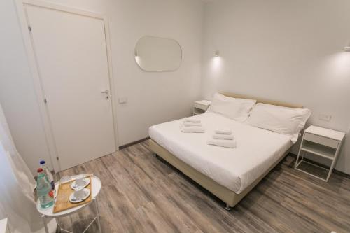 Postel nebo postele na pokoji v ubytování Hotel L'Aretino