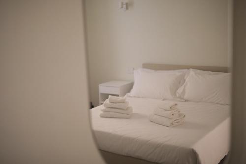 Postel nebo postele na pokoji v ubytování Hotel L'Aretino