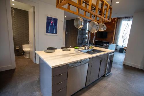 a kitchen with a sink and a counter top at Tuscany by LuxUrban, Trademark Collection by Wyndham in New York