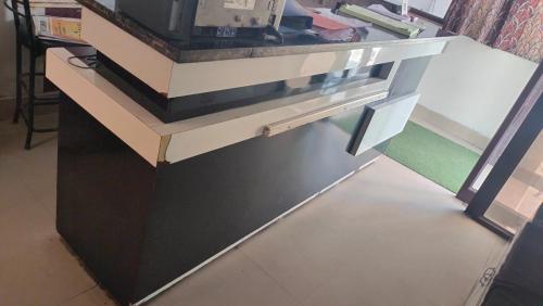 a black and white counter top in a room at Hotel Shiva Palace haridwar nearby bus and railway station in Haridwār