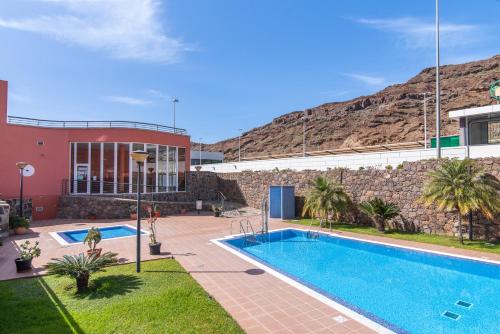 Bazén v ubytovaní Home2Book Comfy Apt Puerto Rico, Pool&Terrace alebo v jeho blízkosti