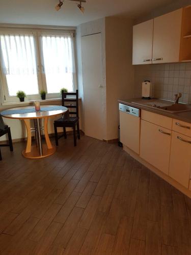 a kitchen with a table and a table and chairs at Ferienwohnung am Peenetal in Bentzin