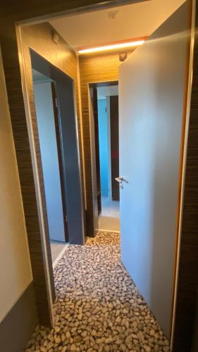 a hallway with three doors in a building at Hotel Ambassador in Bern