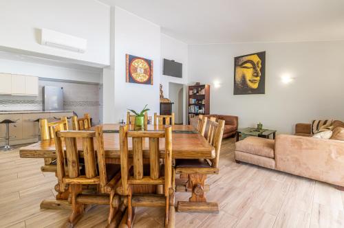 a living room with a wooden table and chairs at Casa Dean by Algarve Golden Properties in Lagos