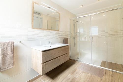 a bathroom with a sink and a shower at Casa Dean by Algarve Golden Properties in Lagos