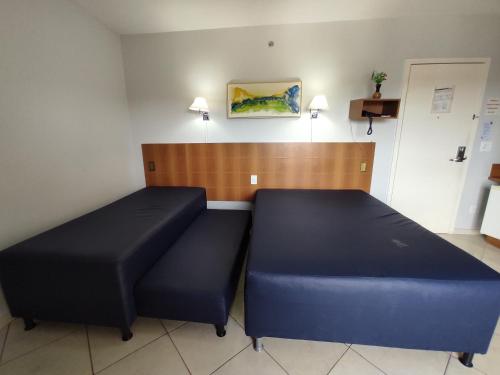 Postel nebo postele na pokoji v ubytování Thermas Place Suíte