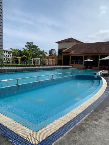 a large swimming pool with blue water at Afamosa Dsavoy Condotel in Kampong Alor Gajah