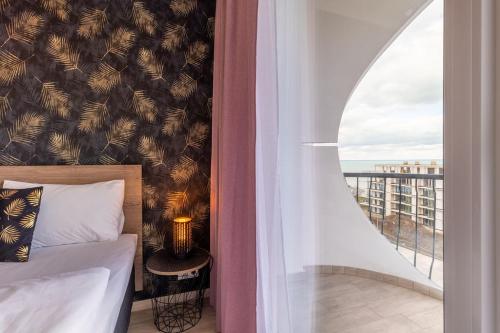 Posteľ alebo postele v izbe v ubytovaní Gold Mandala Apartman Siófok By BLTN