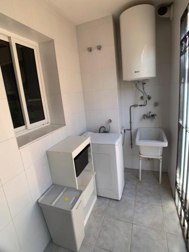 a small bathroom with a sink and a toilet at Apartamento - La Cala in Cala del Moral