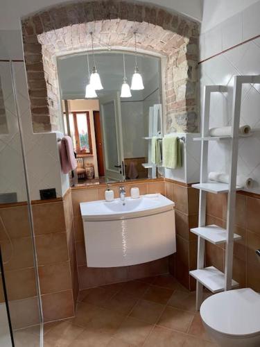 a bathroom with a sink and a mirror at Atelier Fuori Città in Perugia