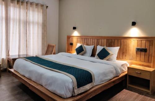 Krevet ili kreveti u jedinici u okviru objekta Gyalsaa Inn