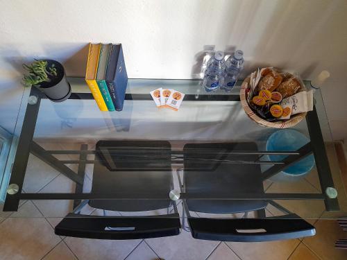 a glass table with a basket of food on it at Pisa Train Stop in Pisa