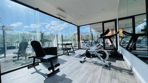 a gym with chairs and a bike in a building at Mayan Water Hotel in Playa del Carmen